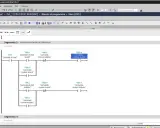 Programmatore che lavora su un software di automazione industriale, creando una logica di controllo per motori.