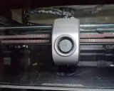 Testa di stampa Creality con ventola e cinghie, pronta per l'input shaping per stampe precise.