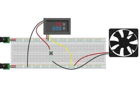 Schema collegamento voltmetro amperometro per ventola. Due alimentatori, un pulsante, un voltmetro/amperometro digitale e una ventola collegati su breadboard.