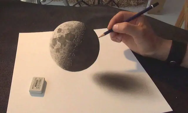 Un incredibile mano 3d disegno della luna, con un'ombra realistica che si proietta sulla carta.