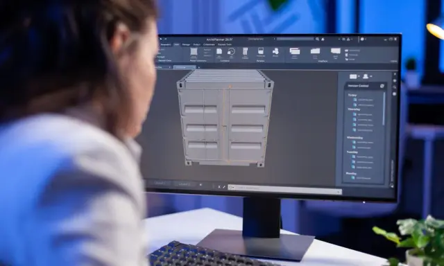 Persona lavora su un modello 3D di un container, esplorando le potenzialità della tecnologia 3D per la progettazione.
